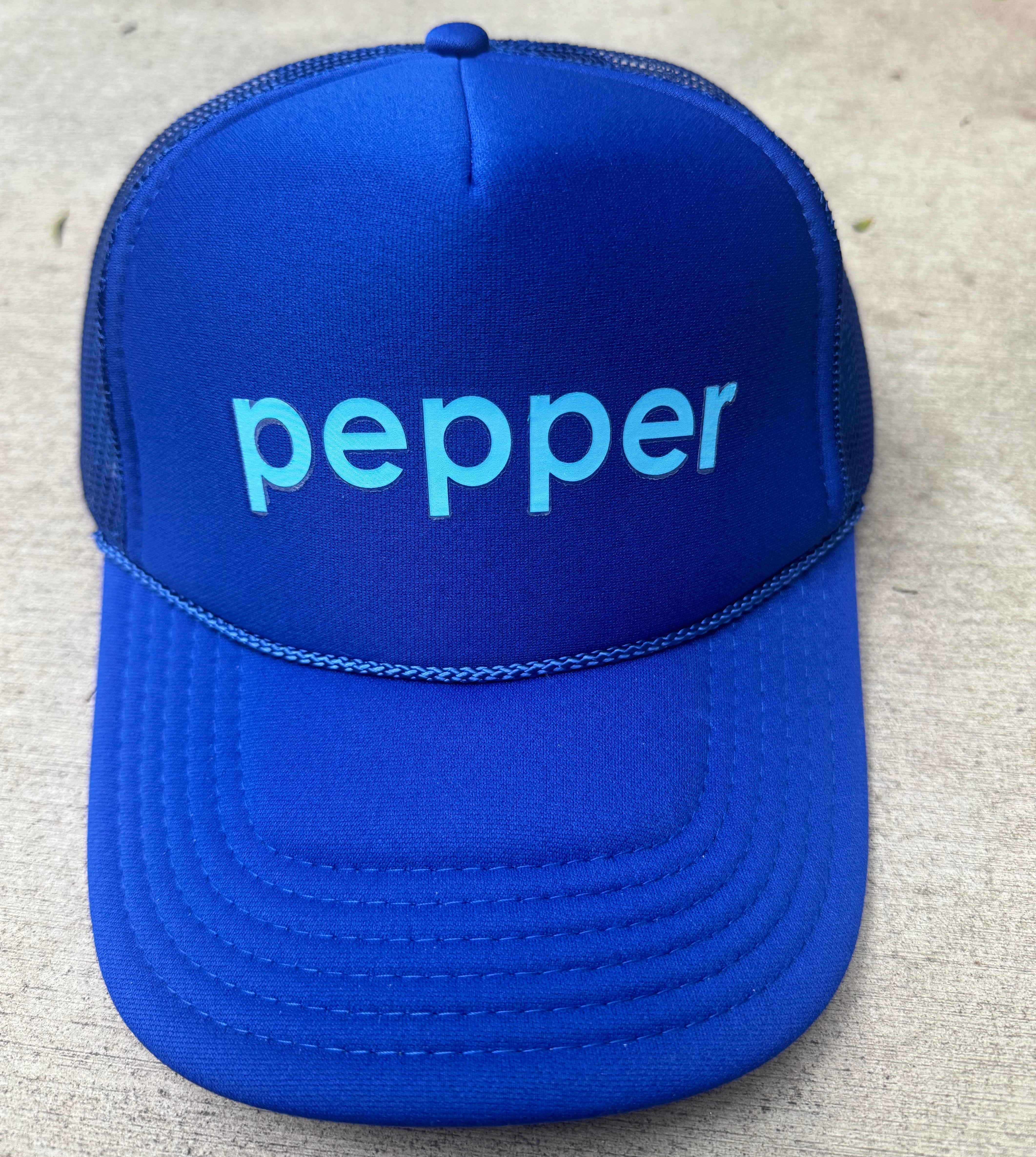 Pepper Logo Trucker Hat light blue logo on navy colored hat