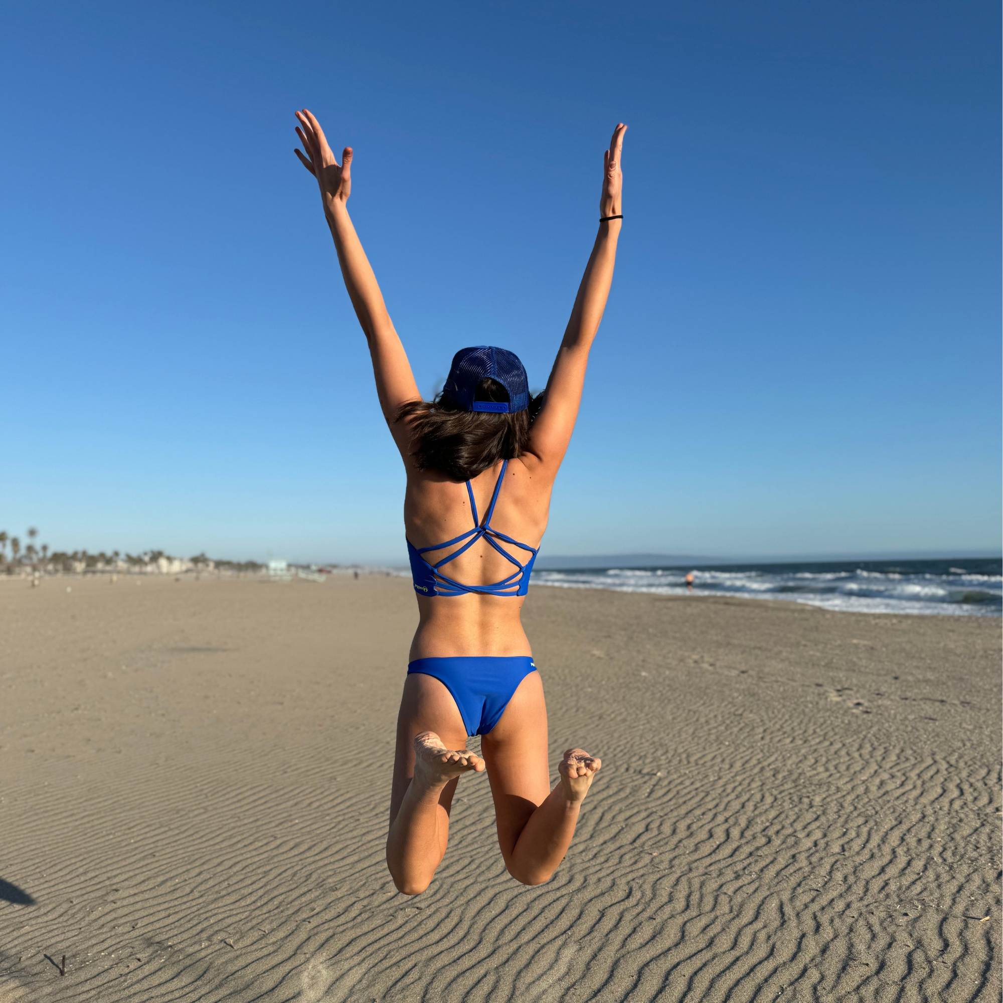 Reversible Sunset Cheeky sport bikini bottom. Sapphire blue reverses to a matisse or talavera tile style print. Mid rise and comfortable for sporty athletic girls and women, great for beach volleyball and surfing. Pepper Swimwear.